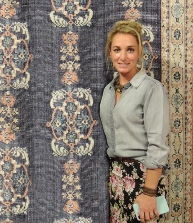 portrait in front of classic rugs